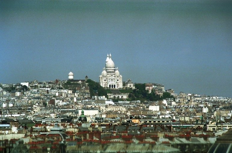 Sacre Coeur viewed at a distance from the roof top of La Samaritaine Paris